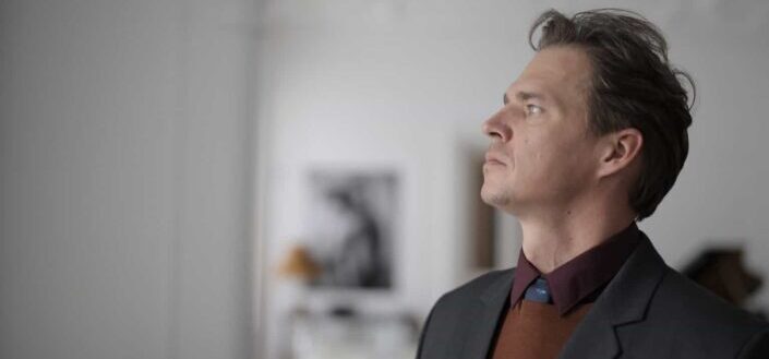 a man looking outside