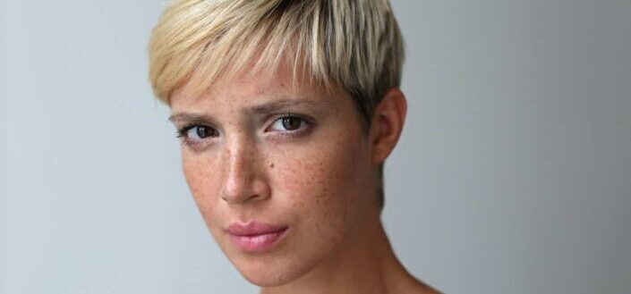 A pretty woman with freckled face