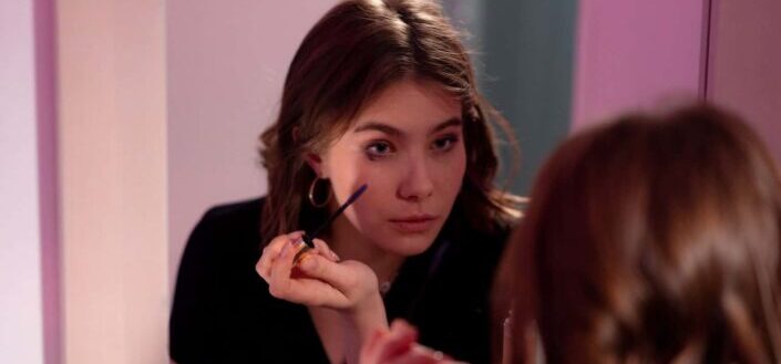 A woman applying makeup