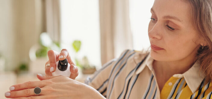woman using hand cream