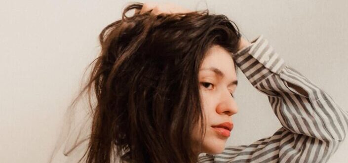 A woman with a messy hair
