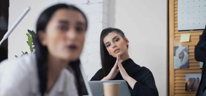 Beautiful woman in black top in office