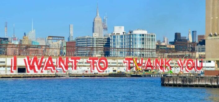 city skyline across body of water during daytime