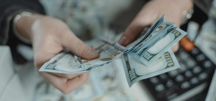 person counting bank notes