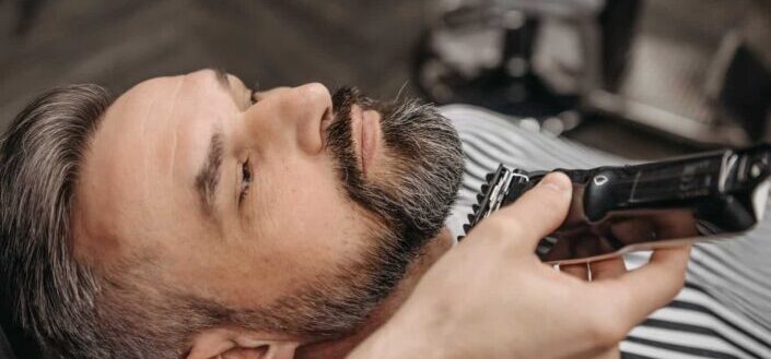 man shaving beard