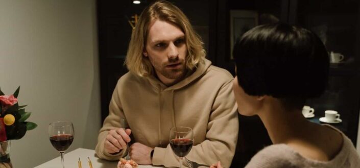 Couple having cake and wine