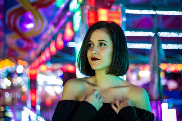 Woman wearing black off shoulder top 