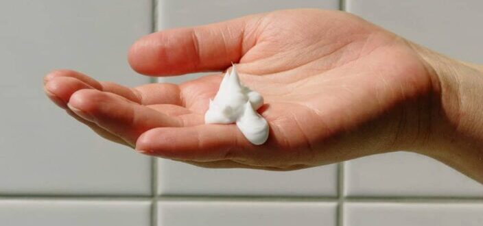Person with soap foam on hand