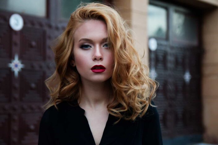 Young blonde woman with bold makeup