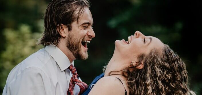 couple laughing together while outside