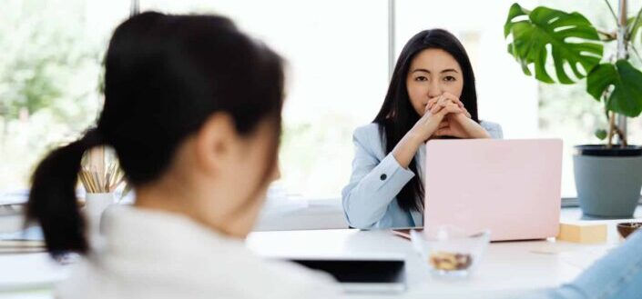 Two women sitting in an office
