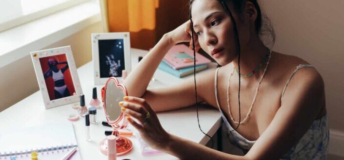 Woman sitting on chair daydreaming
