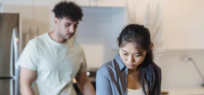 Young man and woman in the kitchen