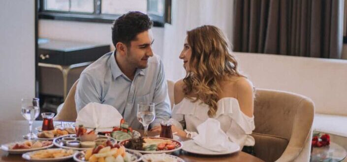 A couple having dinner at the table