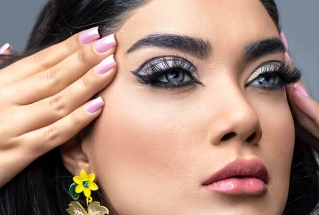 Woman in Makeup and Yellow Flower Earrings - Hailey Bieber Nails